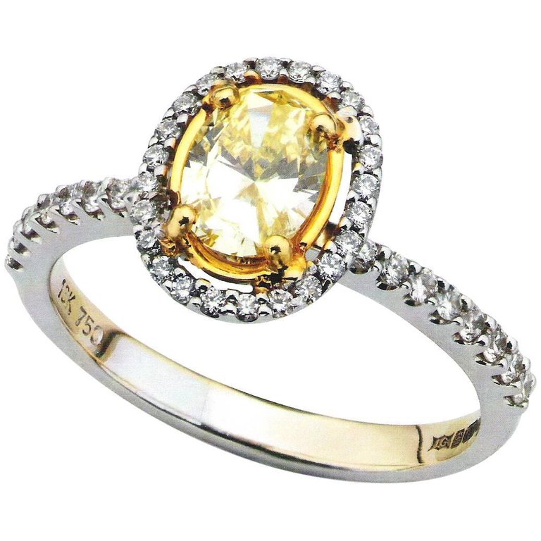 Oval Yellow Diamond Halo Engagement Ring
